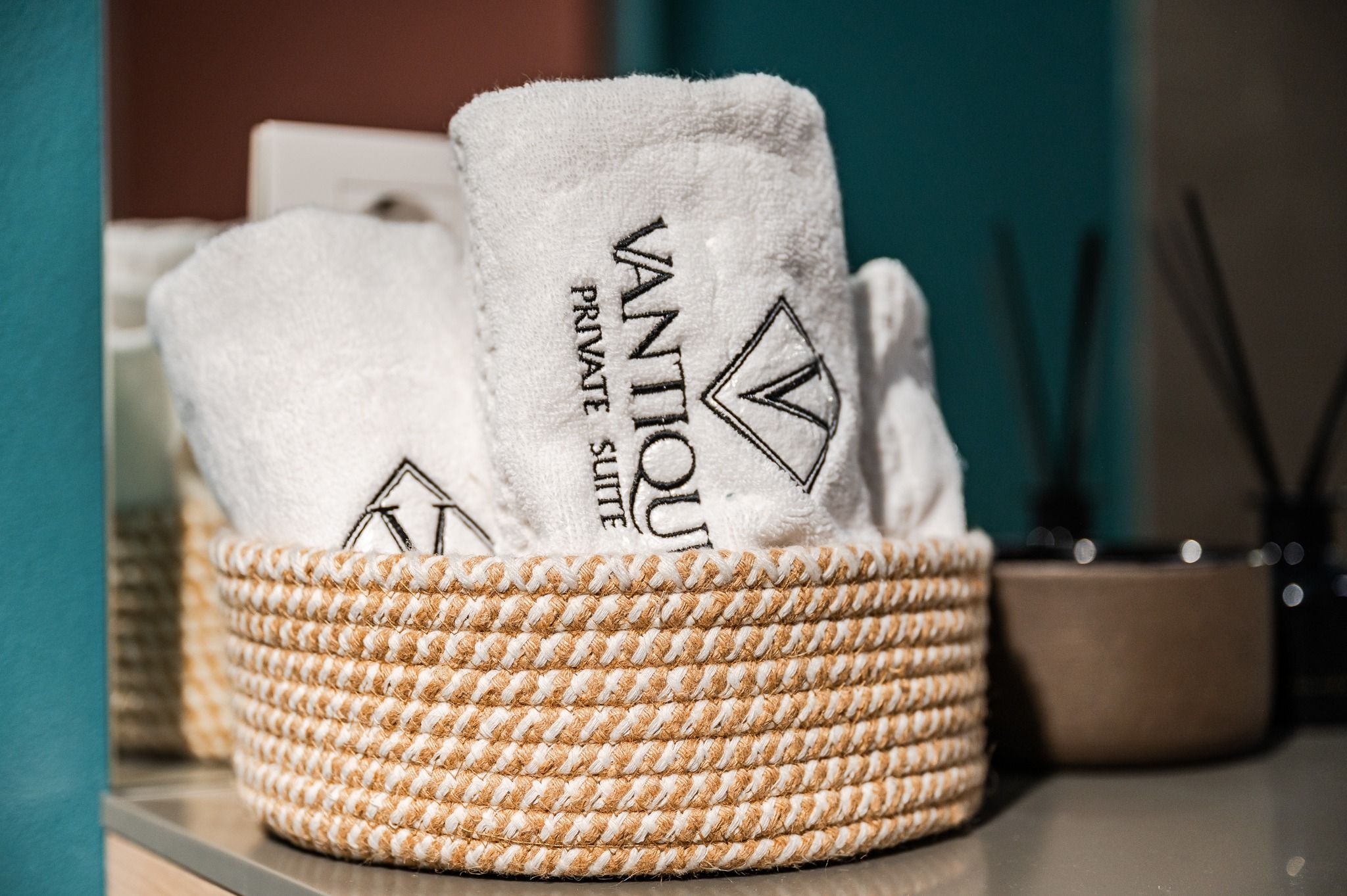 Vantique towels rolled in the wicker basket