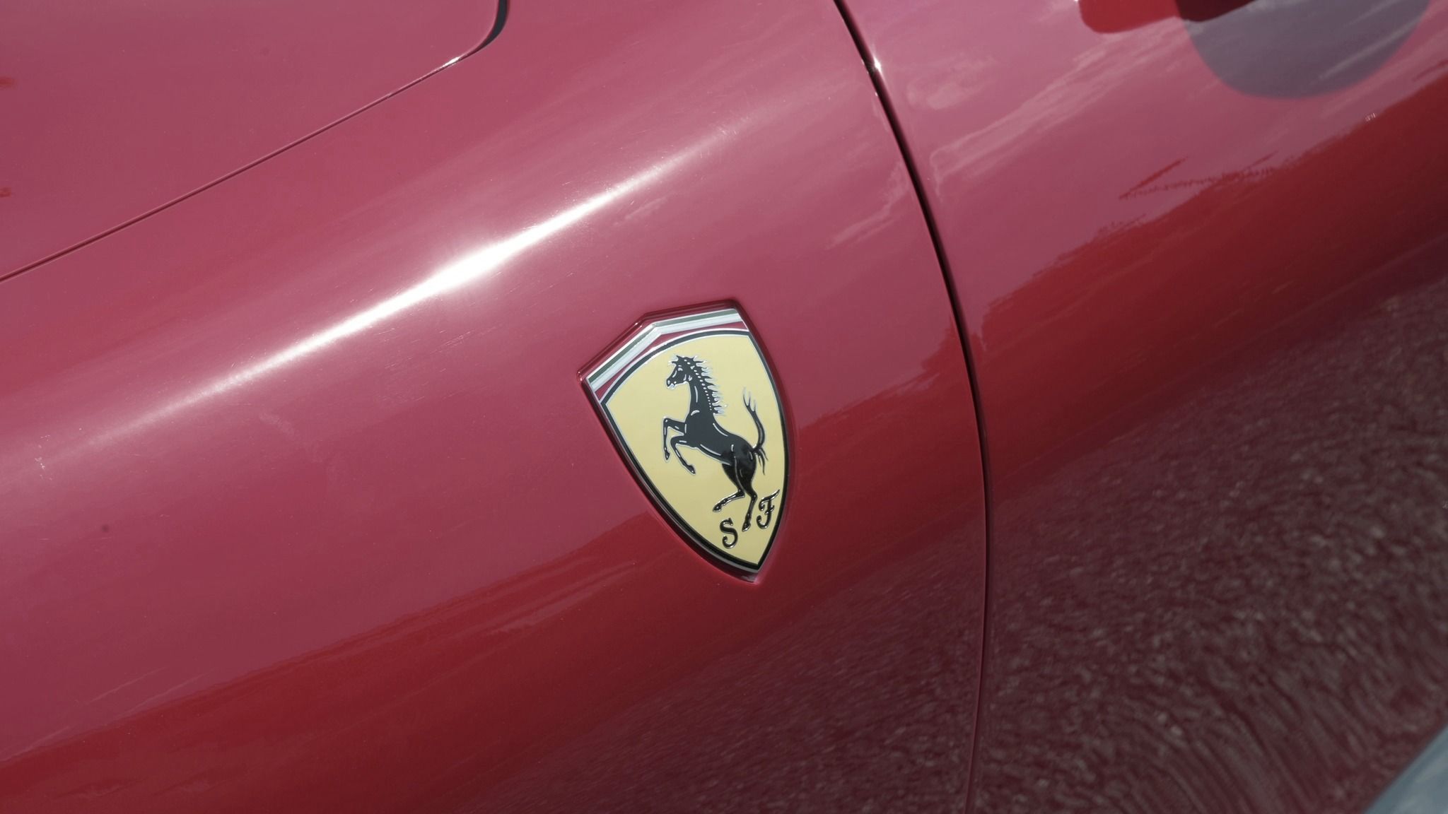 The Ferrari shield on red bodywork