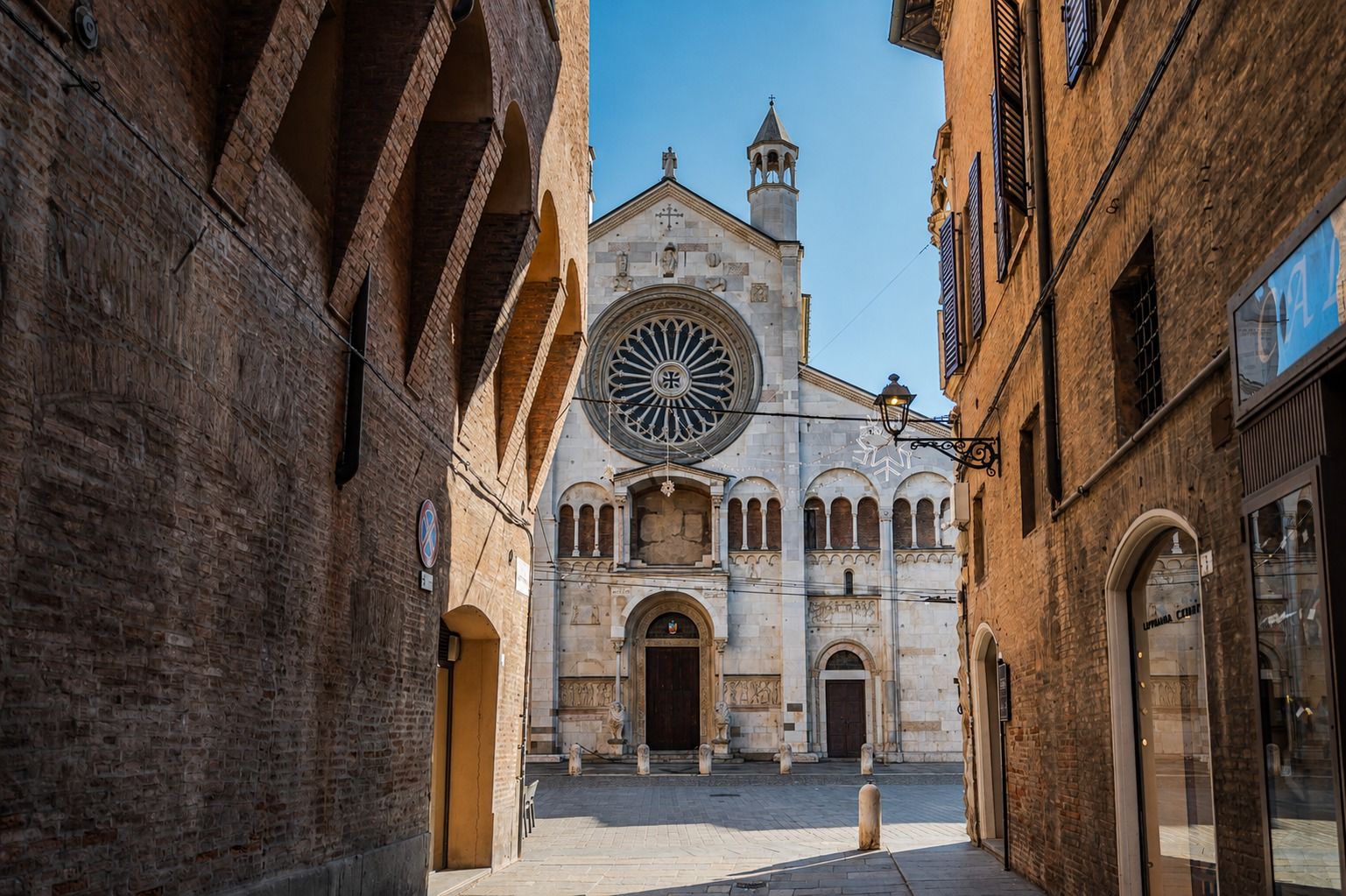 Modena Cathedral seen from under the arcades