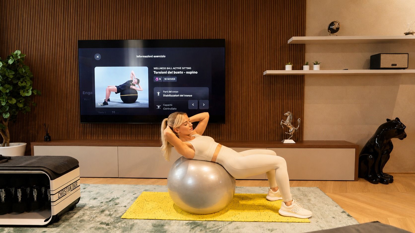 Fitball workout in front of the living-room screen