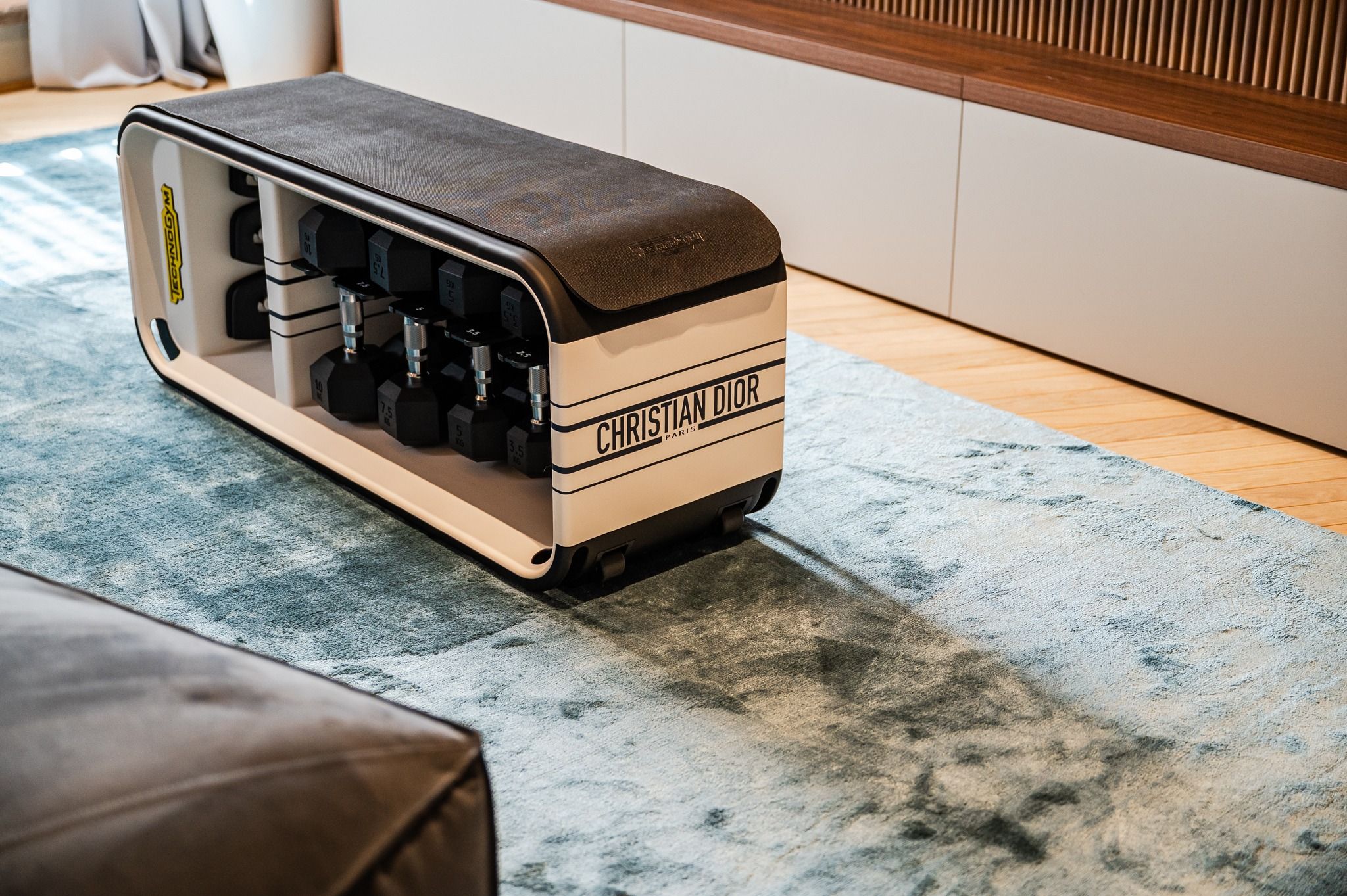 Technogym Bench Christian Dior Edition on the living-room rug