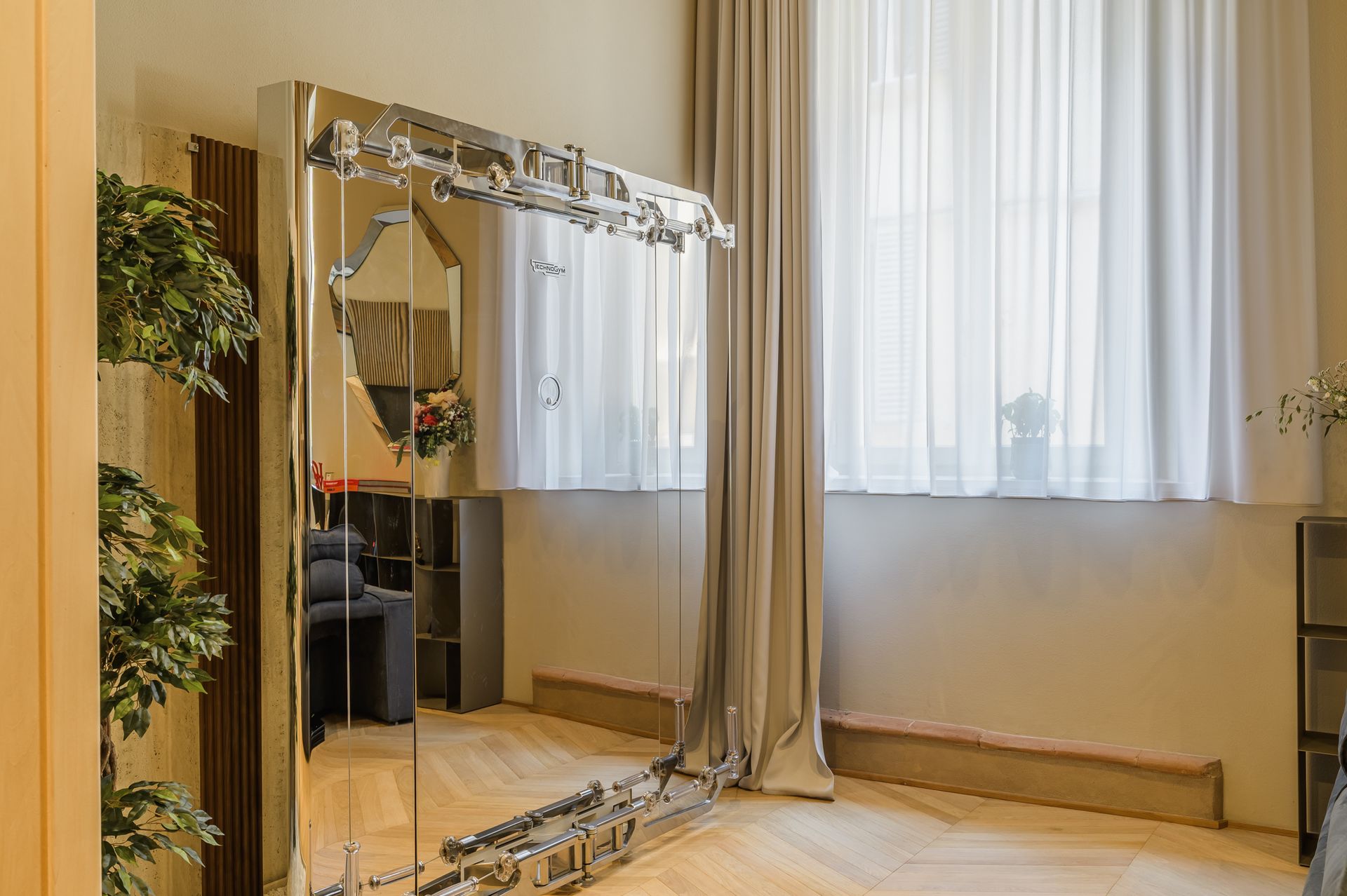 Technogym Kinesis Personal station next to the curtained window